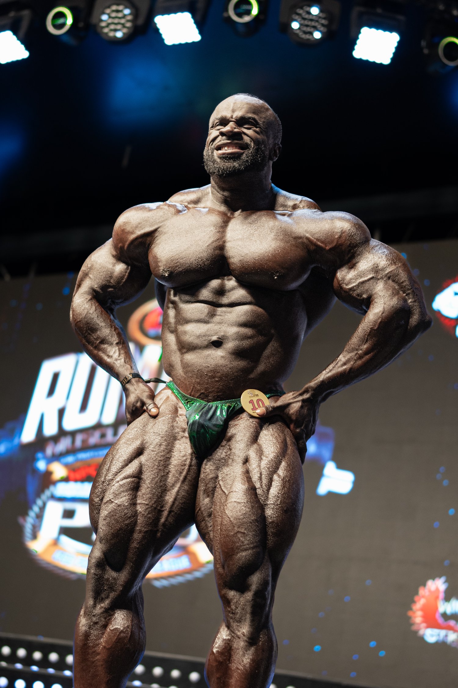 Bodybuilder on stage under competition lights